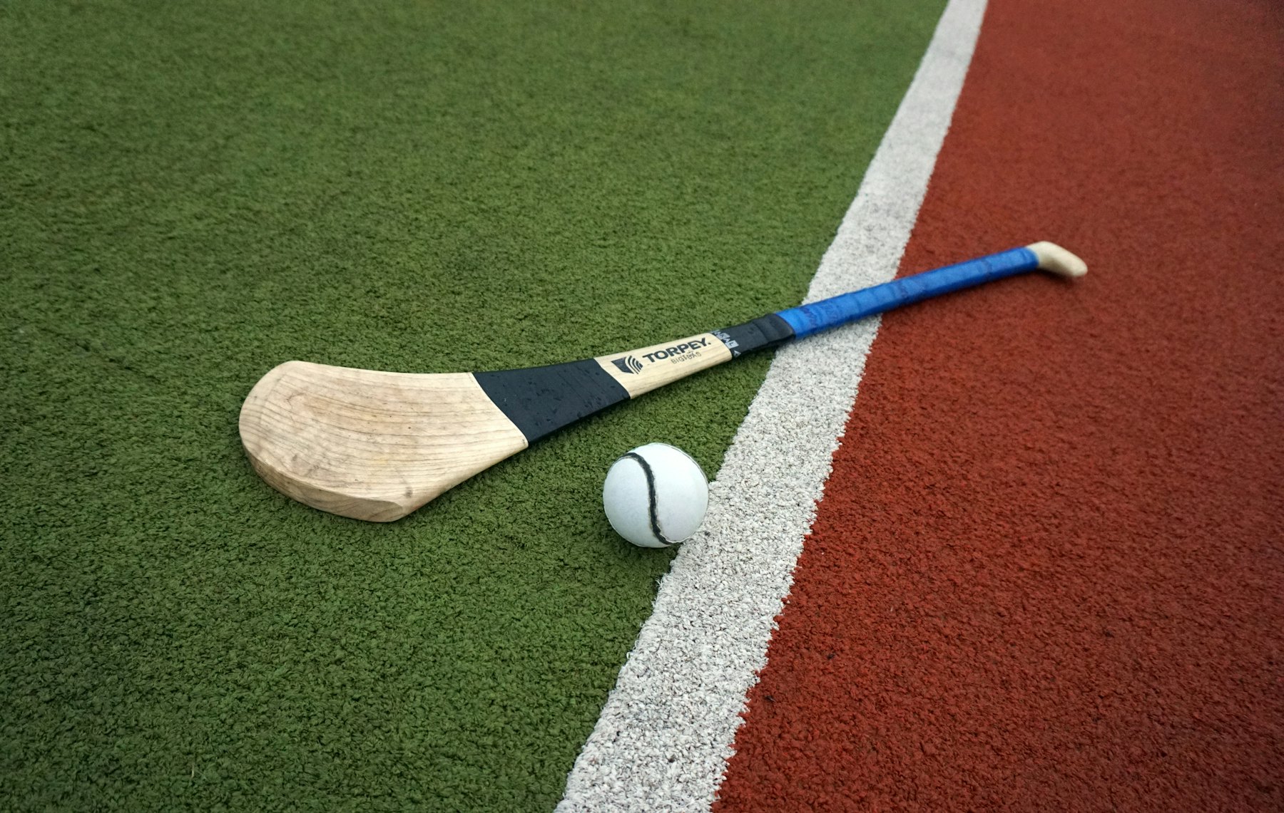 Hurley and sliotar on the pitch